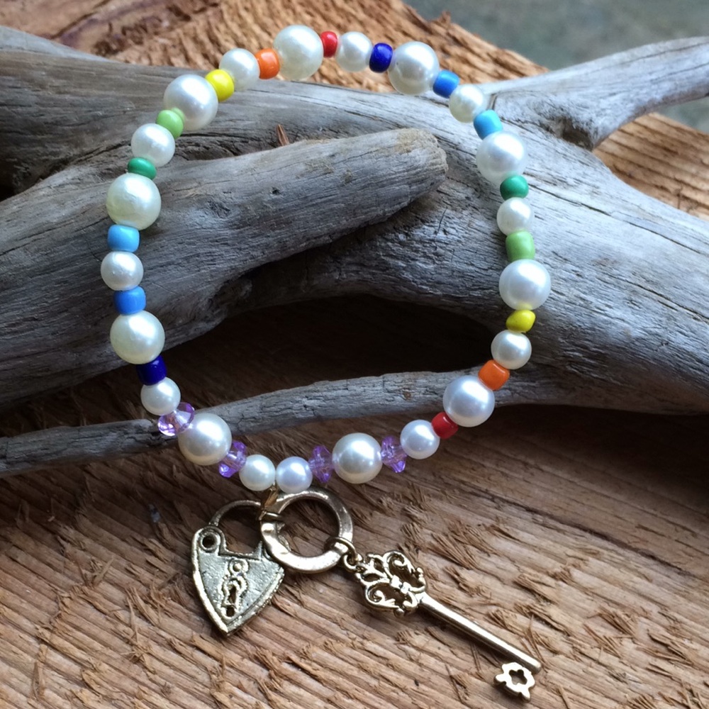 Handmade rainbow bead bracelet with lock and key